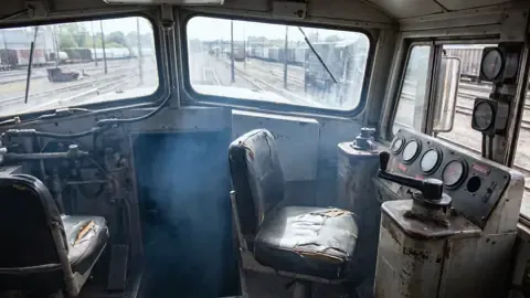 Diesel exhaust haze inside a locomotive cab, a source of railroad diesel exposure